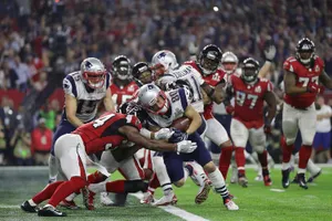 Dynamic Football Tackle Action Shot Wallpaper