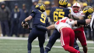 Dynamic Football Tackle In Action Wallpaper