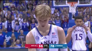 Dynamic Gradey Dick In Action On The Basketball Court Wallpaper