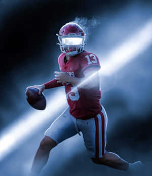 Dynamic Quarterbackin Action Wallpaper