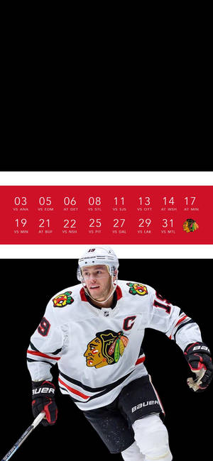 Dynamic Shot Of Jonathan Toews, Number 19 Of The Chicago Blackhawks. Wallpaper