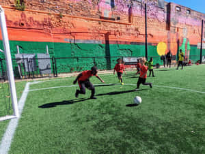 Dynamic Street Soccer Action Wallpaper