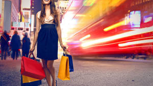 Dynamic Woman On Shopping Spree Wallpaper