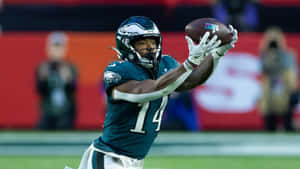 Eagles Player Catching Football Wallpaper