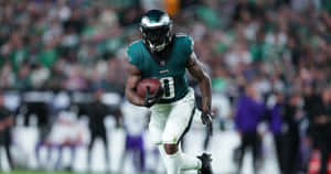 Eagles Player Runningwith Football Wallpaper