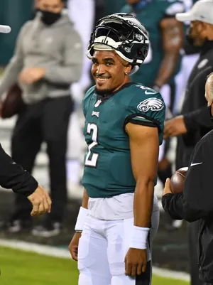 Eagles Quarterback Smiling On Field Wallpaper