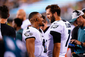 Eagles Quarterbacks Sideline Interaction Wallpaper