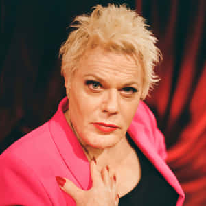 Eddie Izzard Confidently Posing For A Photoshoot Wallpaper