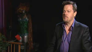 Eddie Izzard Performing Live On Stage Wallpaper