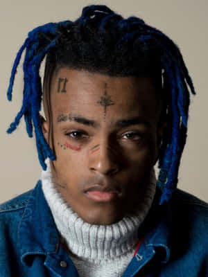 Edgy Finesse: Xxxtentacion Flaunts Unique Style With Blue Hair Wallpaper