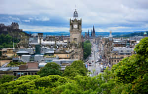 Edinburgh Cityscapewith Historic Clock Tower Wallpaper