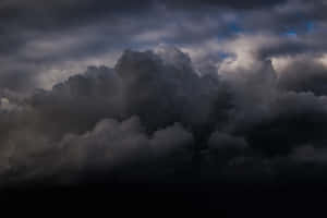 Eerie Dark Skies Over A Mysterious Landscape Wallpaper