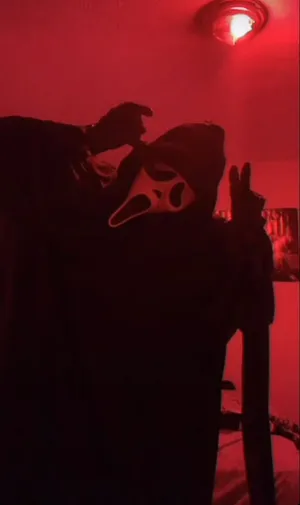 Eerie Ghostface In The Shadows Wallpaper