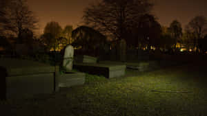 Eerie_ Nighttime_ Cemetery Wallpaper