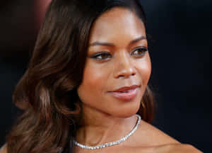 Effervescent Naomie Harris Posing Elegantly Wallpaper