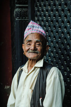 Elderly Man Rejoicing In Traditional Keffiyeh Head Scarf Wallpaper