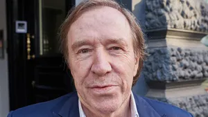 Elderly Man Smiling Casually Outdoors.jpg Wallpaper