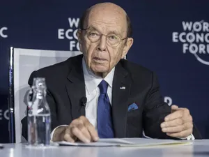 Elderly Man Speakingat World Economic Forum Wallpaper