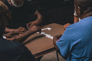 Elderly Playing Dominos Wallpaper