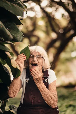 Elderly Woman With A Leaf Wallpaper