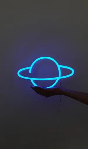 Electric Blue Neon Planet Floatingon Hand Wallpaper