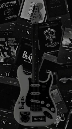 Electric Guitar Among Classic Albums Wallpaper