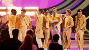 Electrifying Bts Performance On Stage Wallpaper