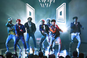 Electrifying Bts Performance On Stage Wallpaper