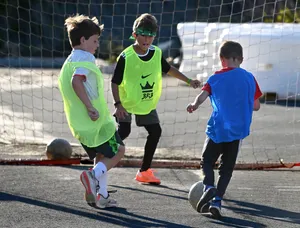 Electrifying Street Soccer Action Wallpaper