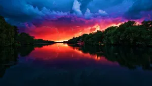Electrifying Sunset Storm Reflection Wallpaper
