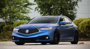 Elegant Acura Tlx Cruising Down An Open Road Wallpaper