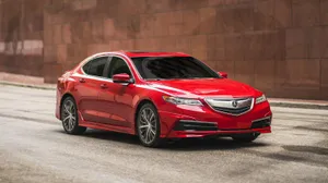 Elegant Acura Tlx Driving Through A Picturesque Landscape Wallpaper