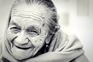 Elegant Aging Gracefully - A Monochrome Portrait Of A Beautiful Older Woman Wallpaper