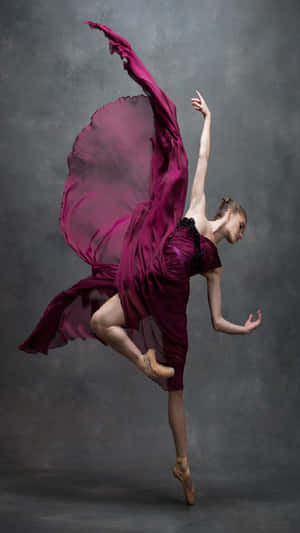 Elegant_ Ballet_ Dancer_in_ Burgundy_ Dress.jpg Wallpaper