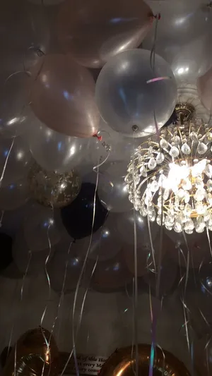 Elegant_ Balloons_and_ Chandelier_ Celebration Wallpaper