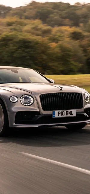 Elegant Bentley Flying Spur In Motion Wallpaper