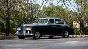 Elegant Bentley S3 In Classic Setting Wallpaper