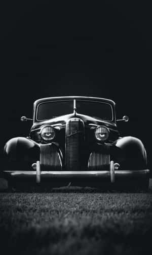 Elegant Black And White Car In Motion Wallpaper