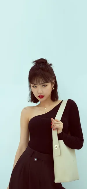 Elegant Black Outfitand White Bag Wallpaper