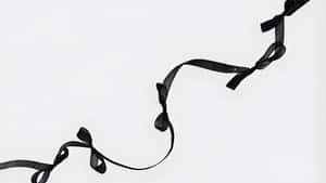 Elegant Black Ribbon Bow Wallpaper