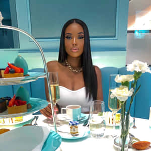 Elegant Black Woman Enjoying Luxury Dining Wallpaper