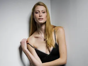 Elegant Blonde Woman Black Dress Wallpaper