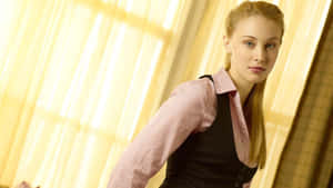 Elegant Blonde Woman Business Attire Wallpaper