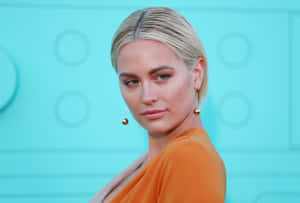 Elegant Blonde Woman Orange Dress Wallpaper