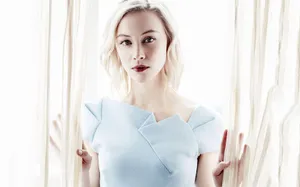 Elegant Blonde Womanin Blue Dress Wallpaper