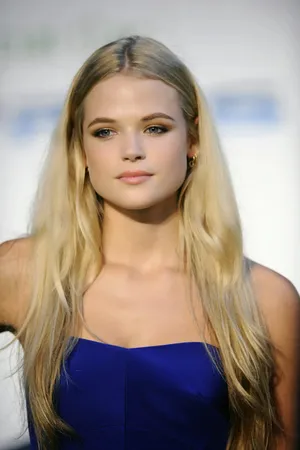 Elegant Blonde Womanin Blue Dress Wallpaper