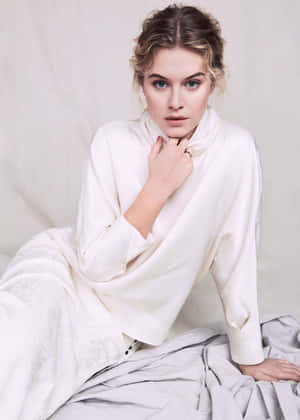 Elegant Blonde Womanin White Attire Wallpaper