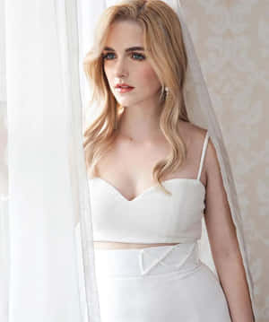 Elegant Blonde Womanin White Dress Wallpaper
