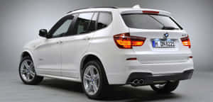 Elegant Bmw X3 Cruising On The Highway. Wallpaper