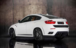 Elegant Bmw X6 Driving Through The Night Wallpaper